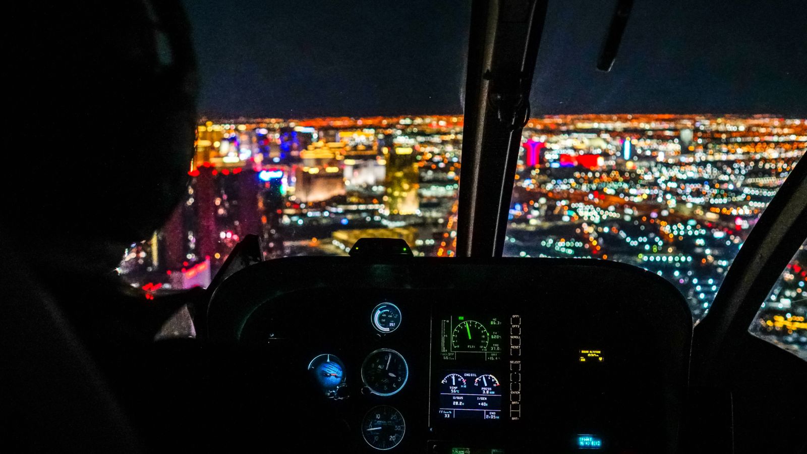 Views of the Las Vegas Strip at night from the inside of the helicopter.