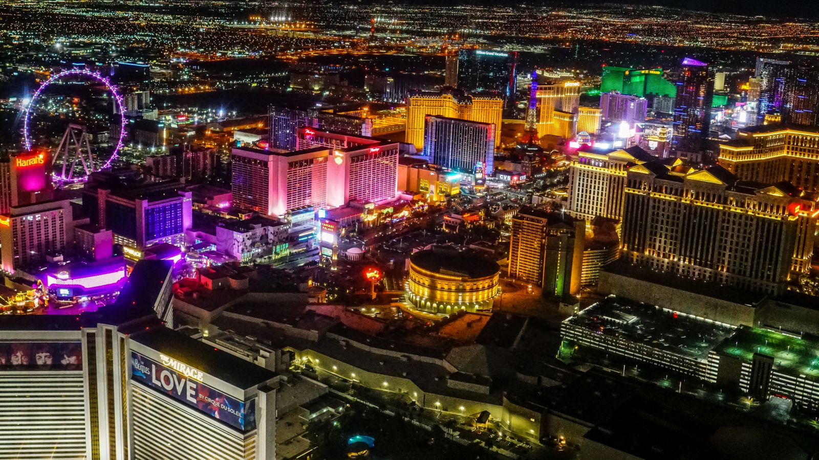 The Strip casinos and Colosseum seen from a nighttime helicopter tour