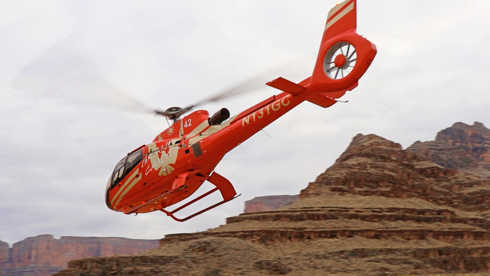 A helicopter provides transportation from the bottom of the canyon to the to of the Grand Canyon West Rim rim