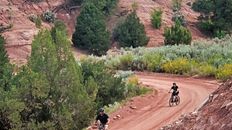 Two mountain bikers riding a trail at bryce canyon.