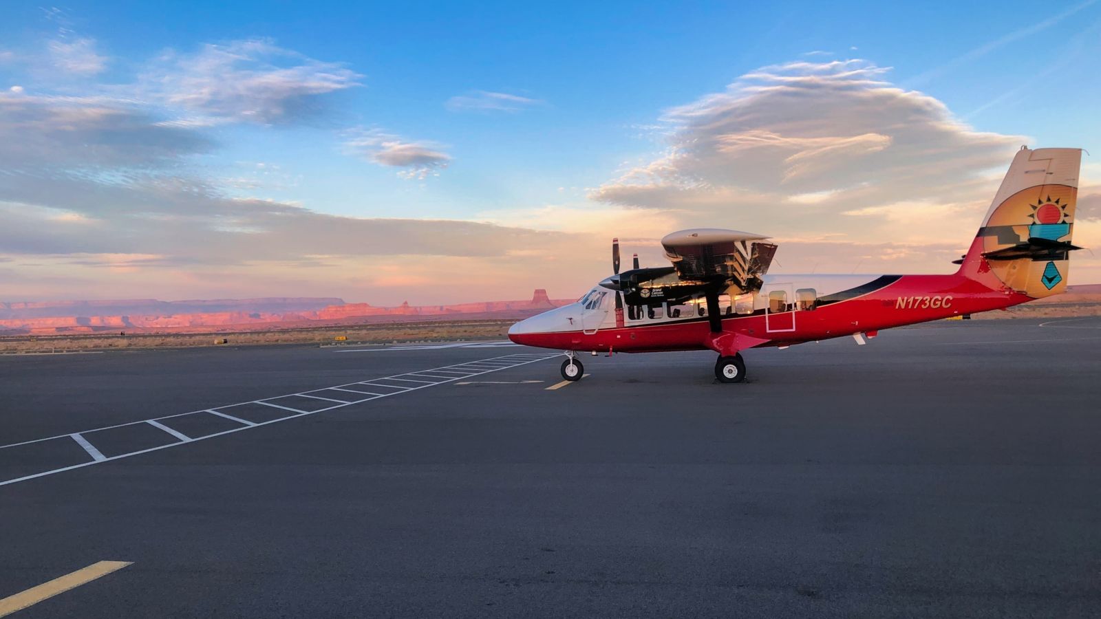 an airplane parked at Page Municipal Airport after transporting passengers from Grand Canyon National Park to Page AZ