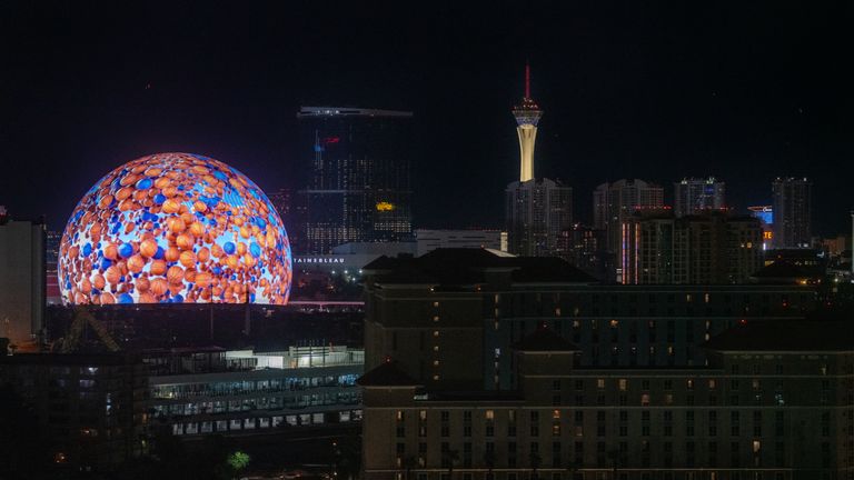 the MSG Sphere illuminated with images of basketballs at night