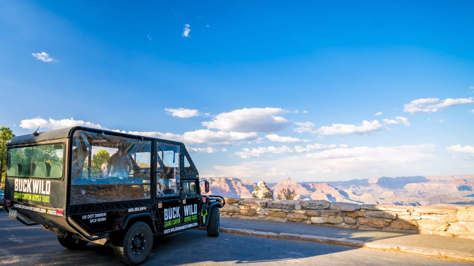 A military-style Hummer parked at the famous Duck on a Rock landmark