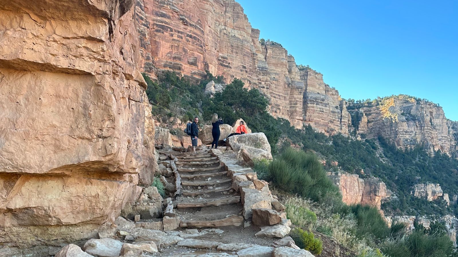 a group of hikers take photos on Grandview Trail at the Grand Canyon National Park
