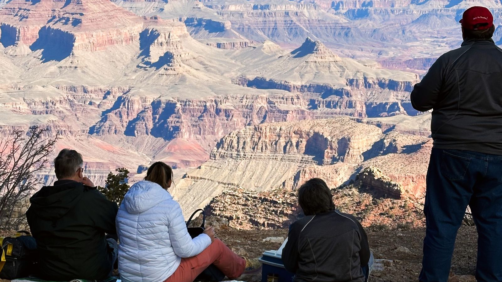 a Grand Canyon tour group enjoying a picnic at a South Rim lookout point