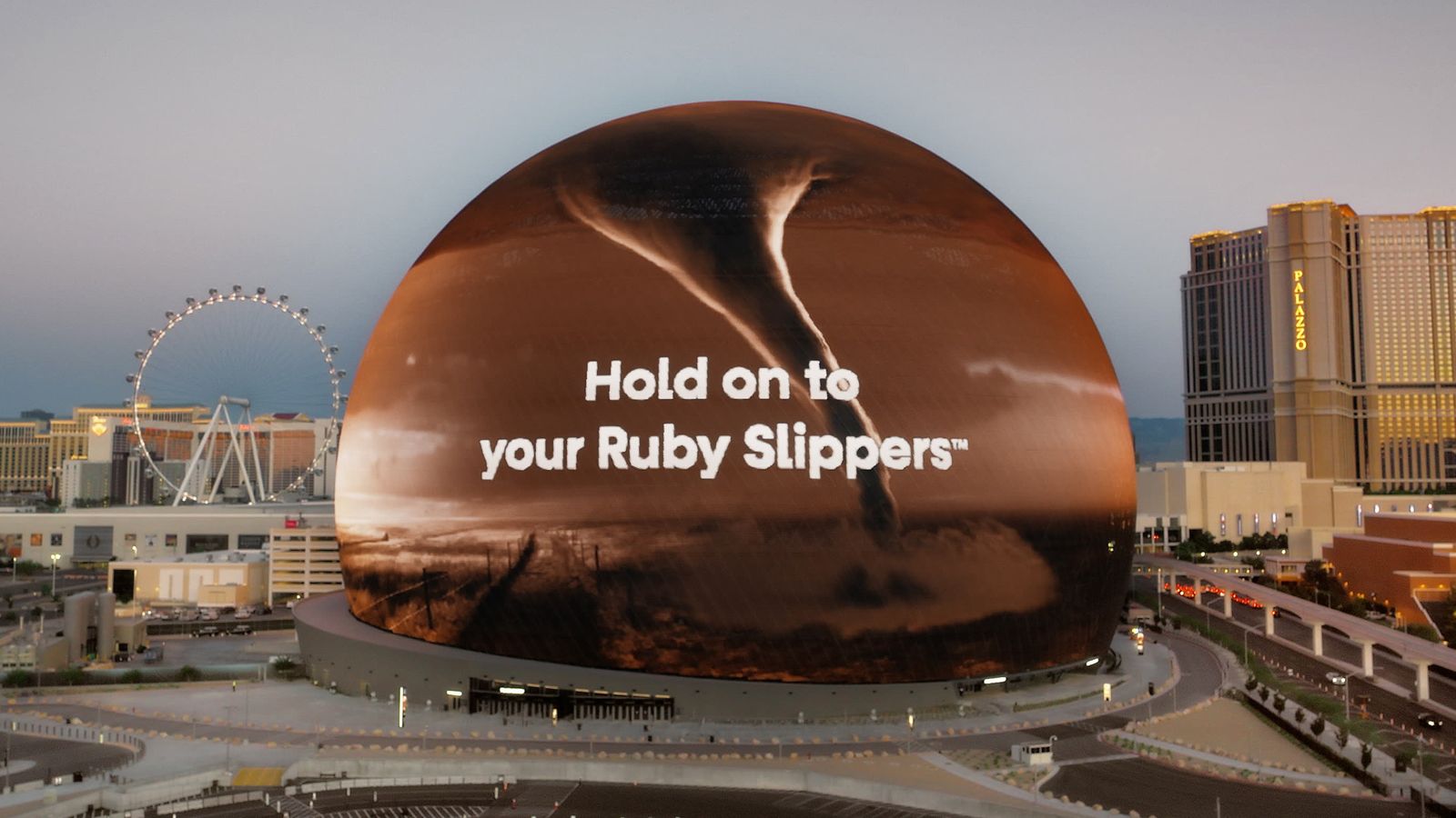 The Sphere at Venetian seen with a Wizard of Oz promotion featuring a tornado and ruby slippers