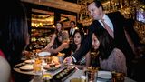 Guests participating in a Las Vegas foodie tour being served luxury  dishes