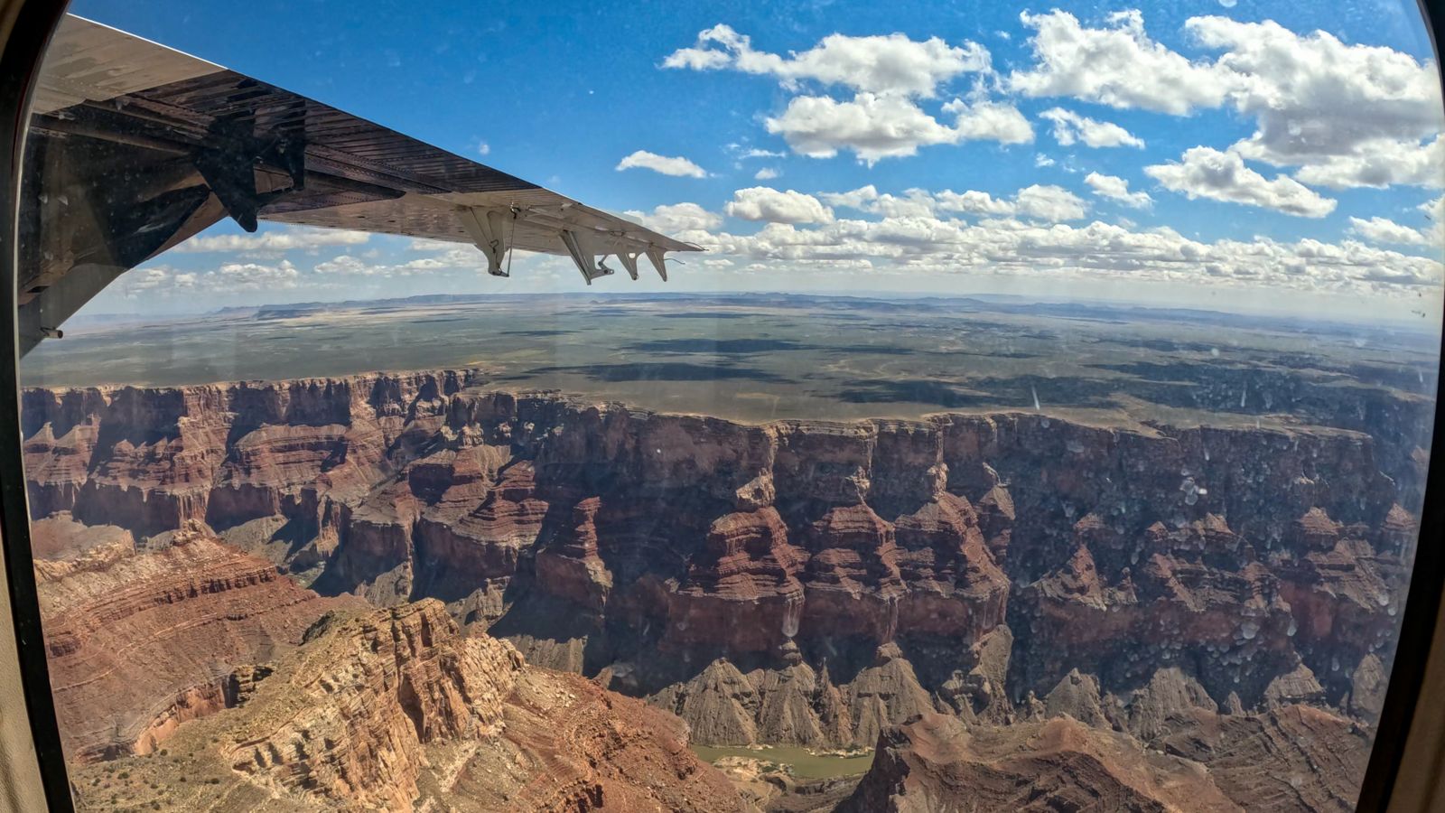The East Rim of the Grand Canyon seen from inside an airplane tour