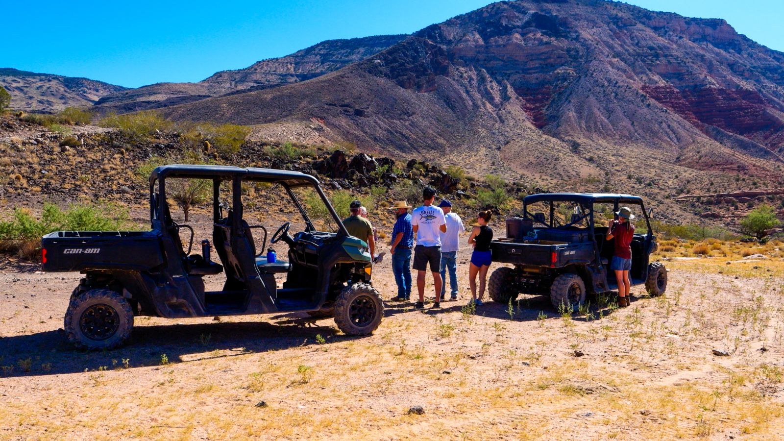 Visitors to the ranch during a UTV tour learning about the area's history