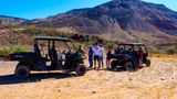 Visitors to the ranch during a UTV tour learning about the area's history