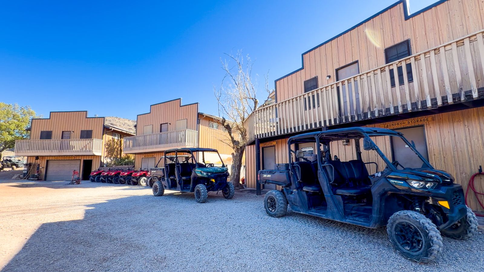 Western-style buildings on Bar 10 Ranch's property seen with off-road vehicle in front