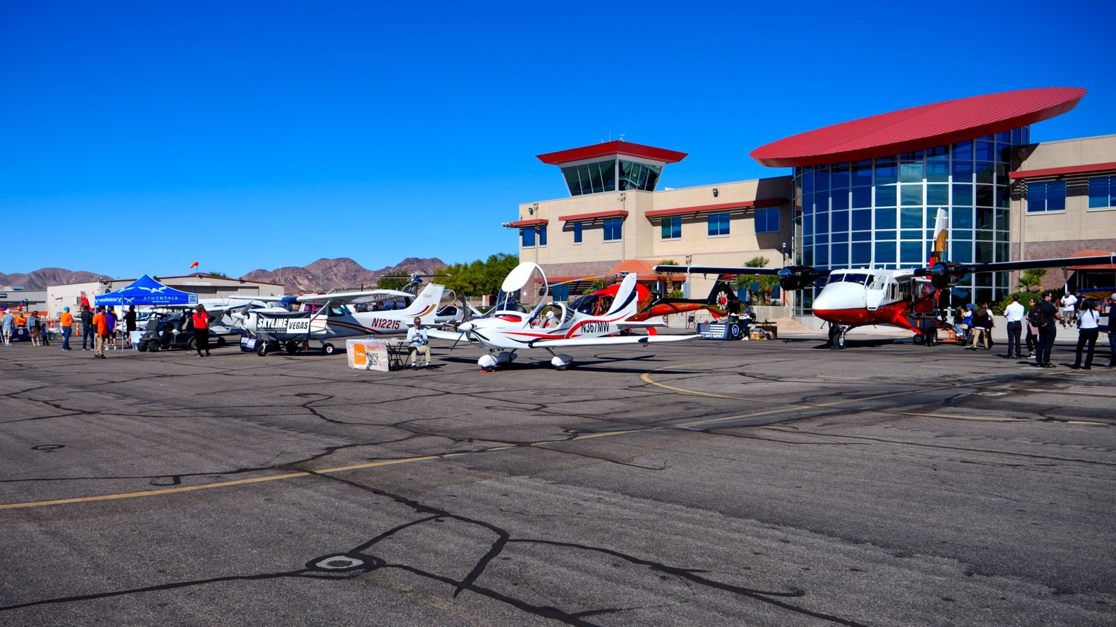 Groups of visitors wander the Papillon tarmac on Boulder City Airport Day