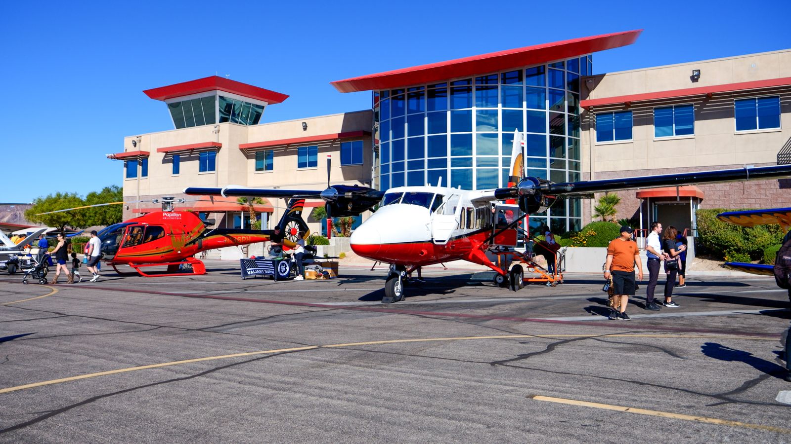 A sightseeing airplane and a helicopter on the Papillon tarmac