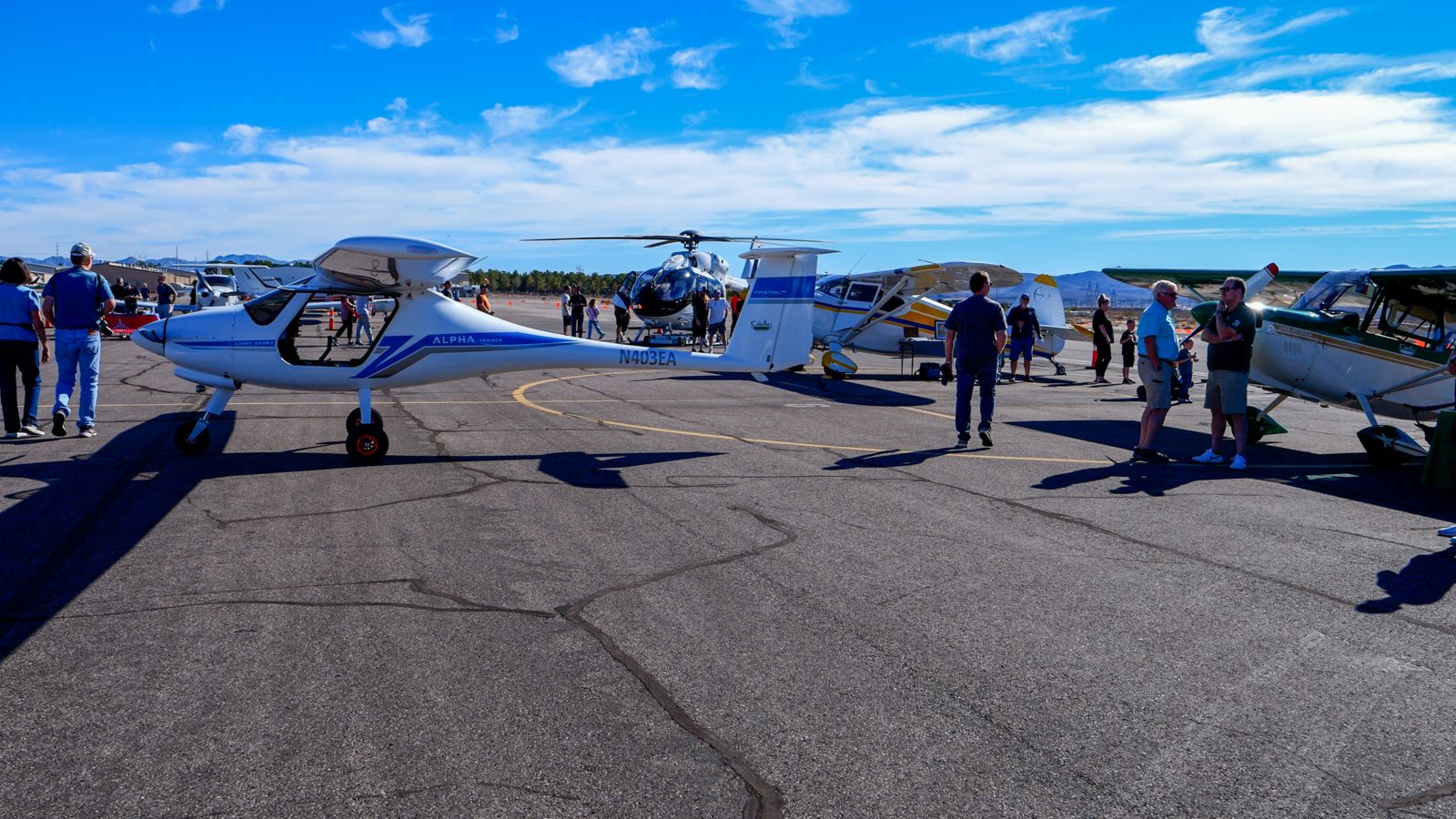 Visitors to the Papillon Boulder City air terminal gather around a sightseeing airplane