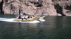 A raft full of people going through Black Canyon on the Colorado River.