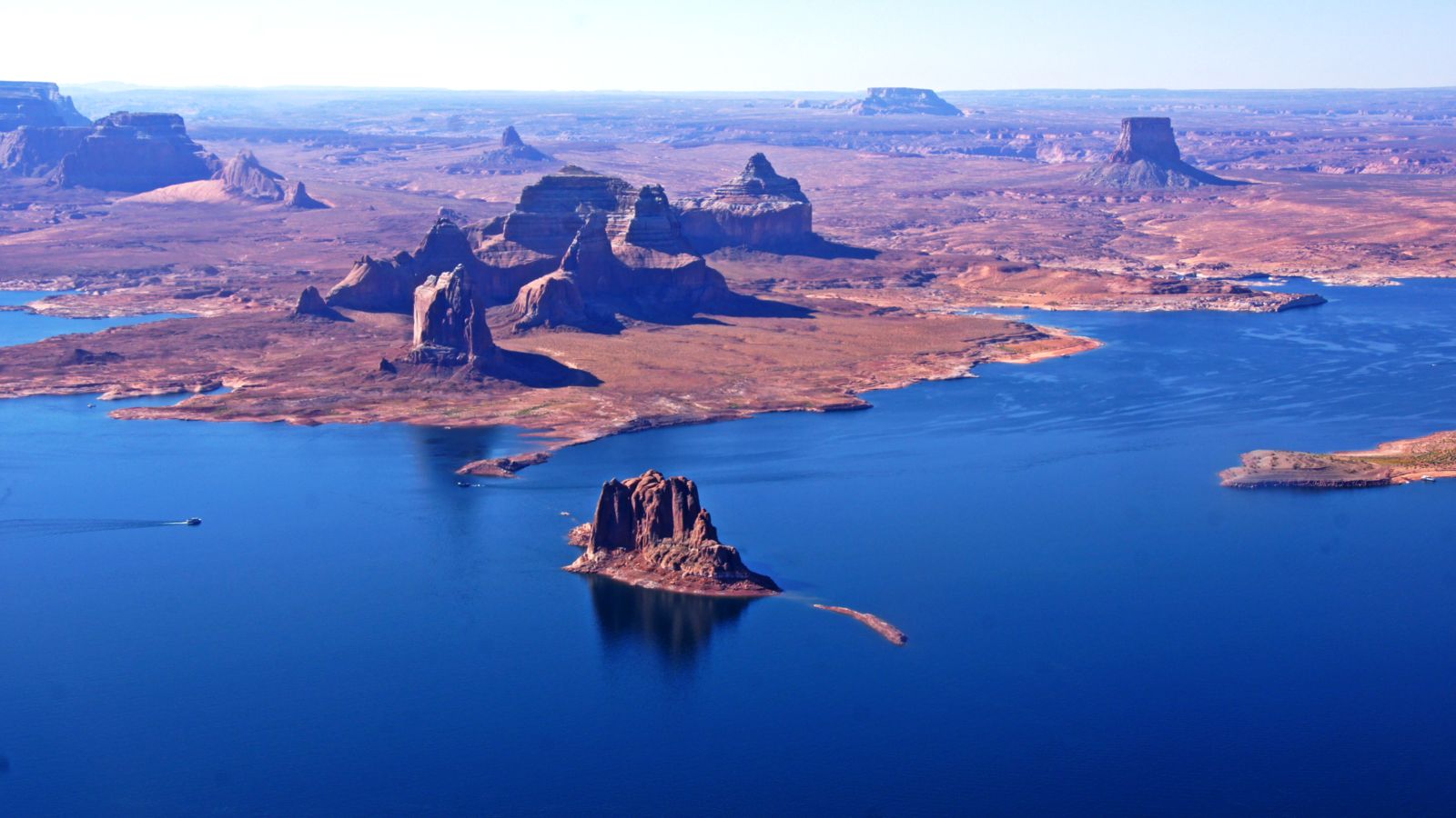 the sparkling waters of lake powell seen from above on an airplane tour