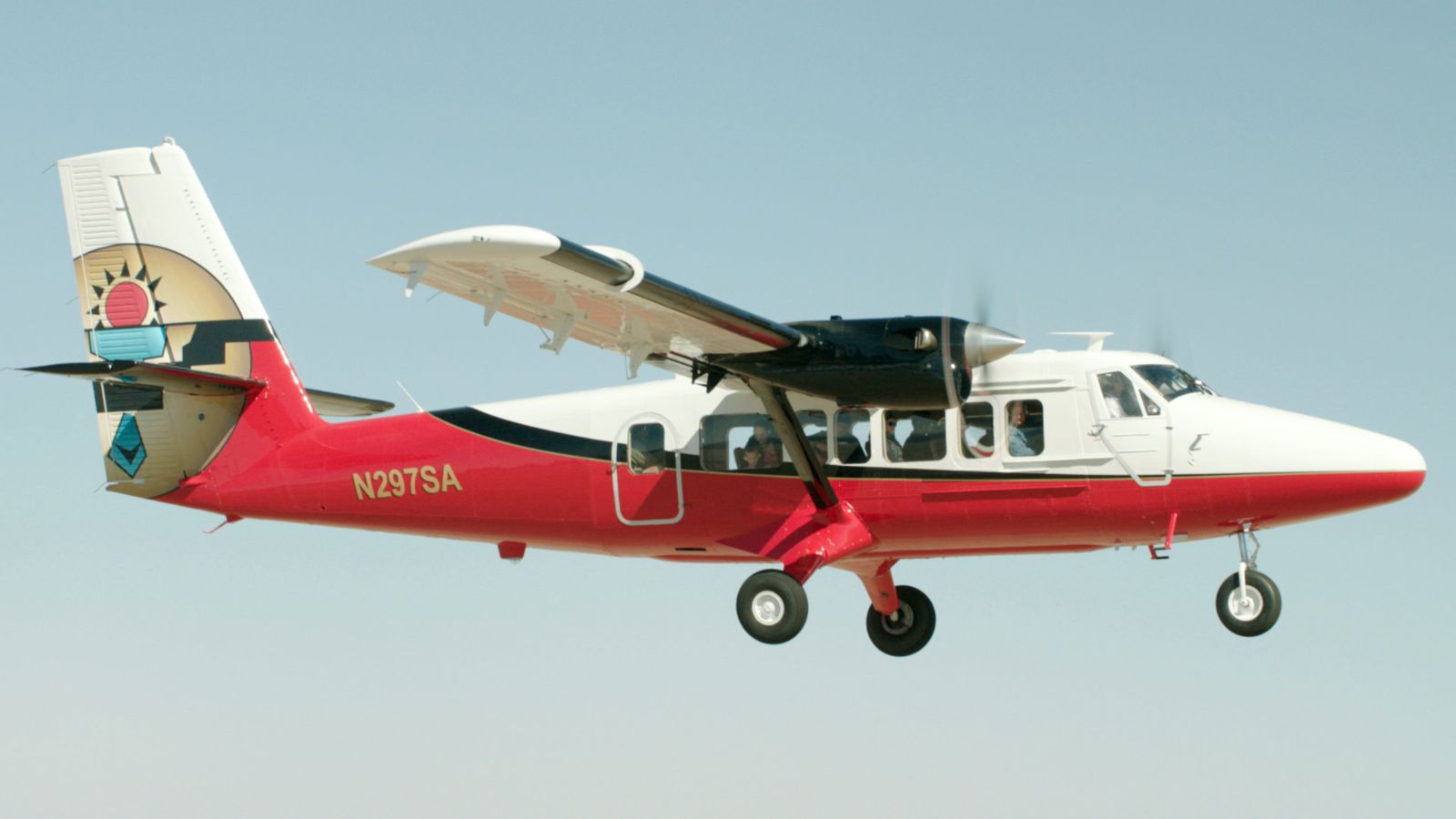 Fixed-wing airplane tour flying in the air on its way to the Grand Canyon West Rim