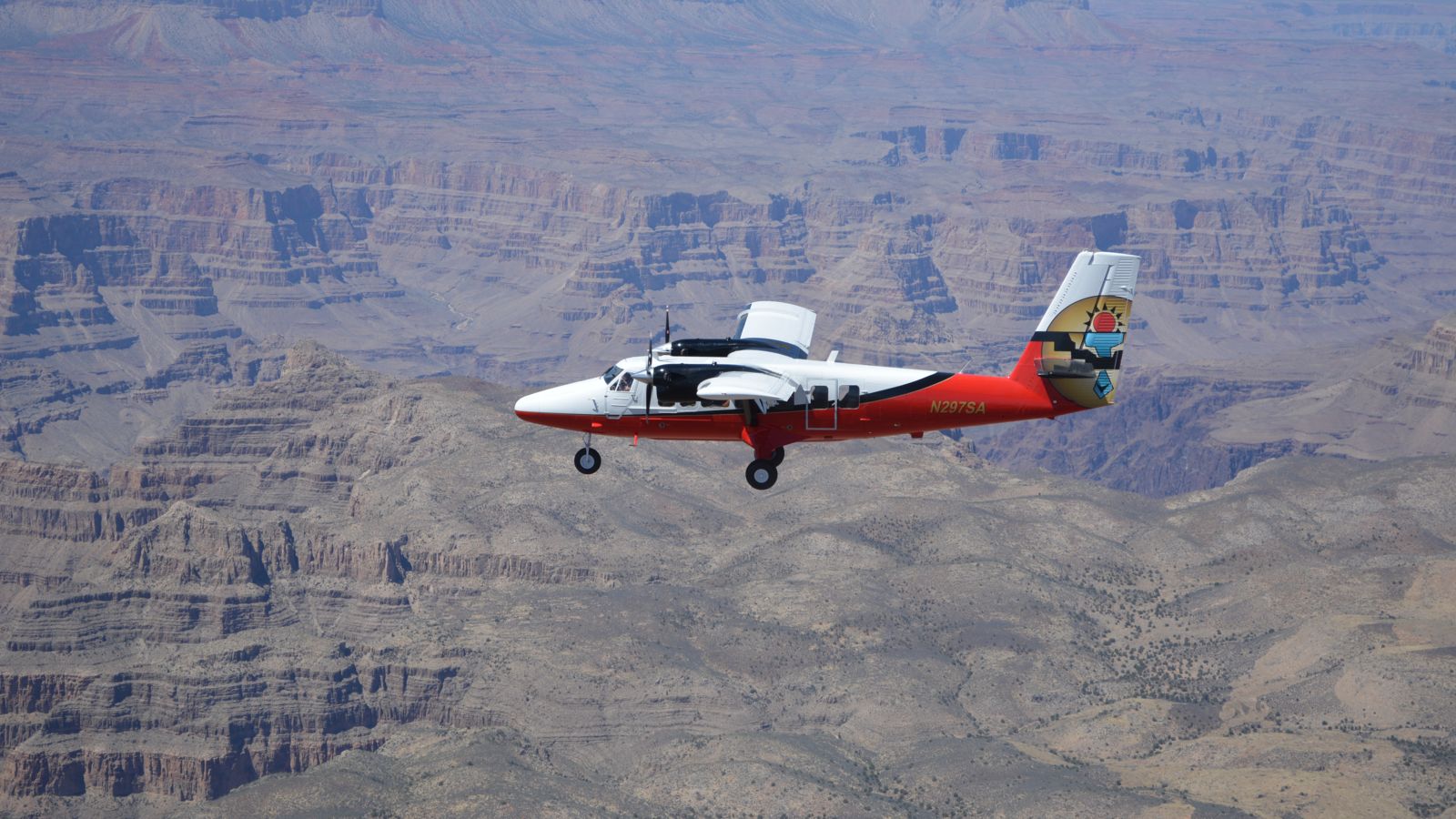 a sightseeing airplane tour flies over the Grand Canyon South Rim