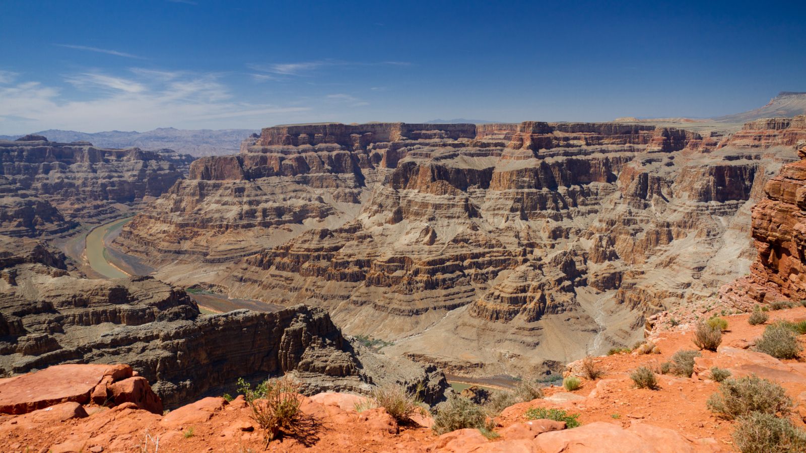 a stunning view of Grand Canyon West walls on a bright sunny day with clear skies