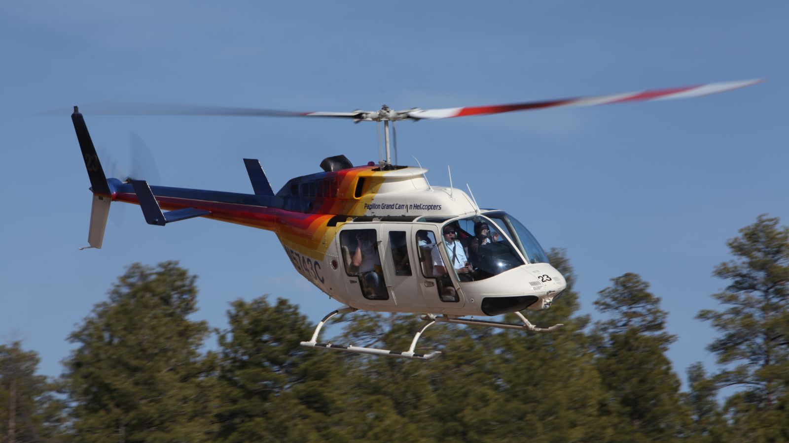 Bell Helicopter is flying over the Grand Canyon National Park