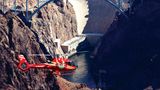 Las Vegas helicopter tour flies over desert landscape with Hoover Dam in background