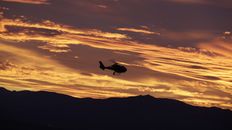 Helicopter illuminated by the setting sun