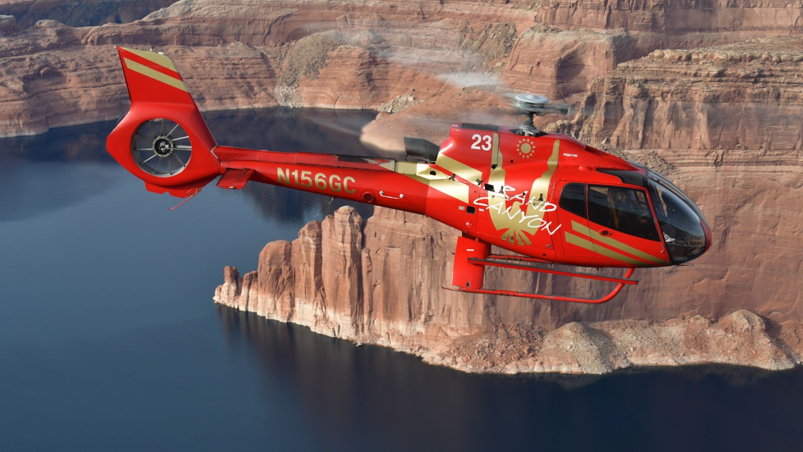a horseshoe bend helicopter tour flies across lake powell