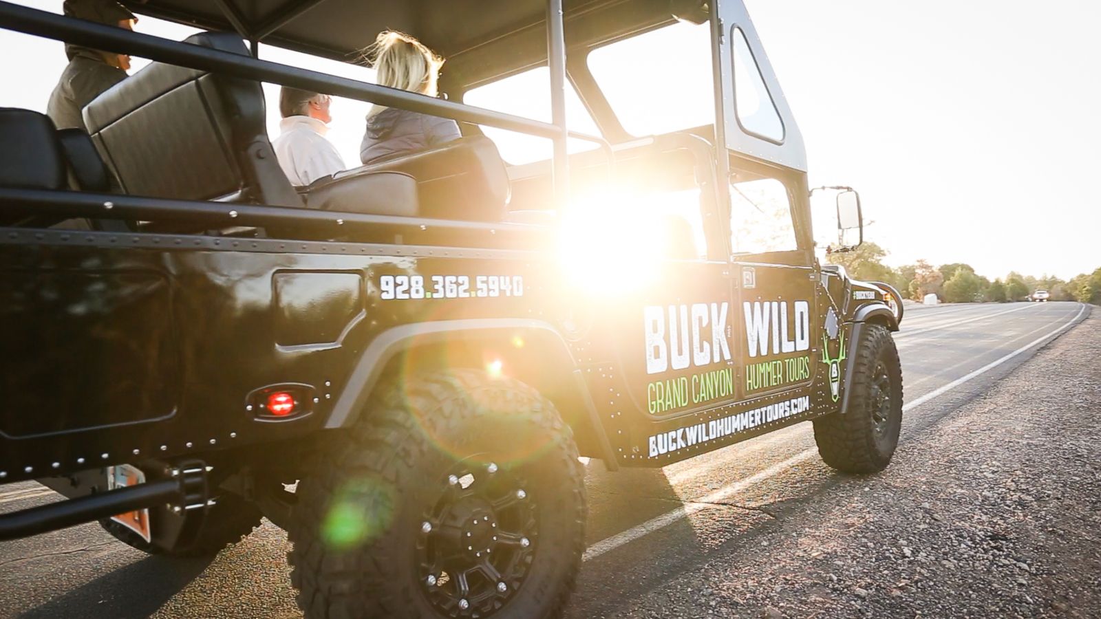 Lens Flare through the window of a parked Buck Wild Hummer.