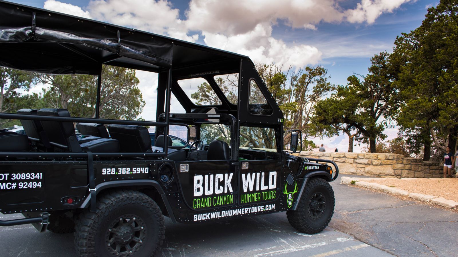 Buck Wild Hummer parked by a viewing spot at Grand Canyon National Park.