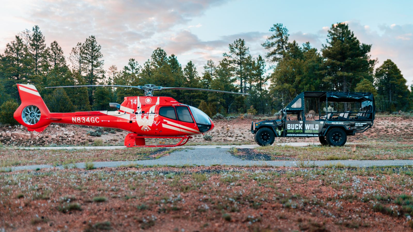 An EC130 helicopter parked on the tarmac at Grand Canyon Airport