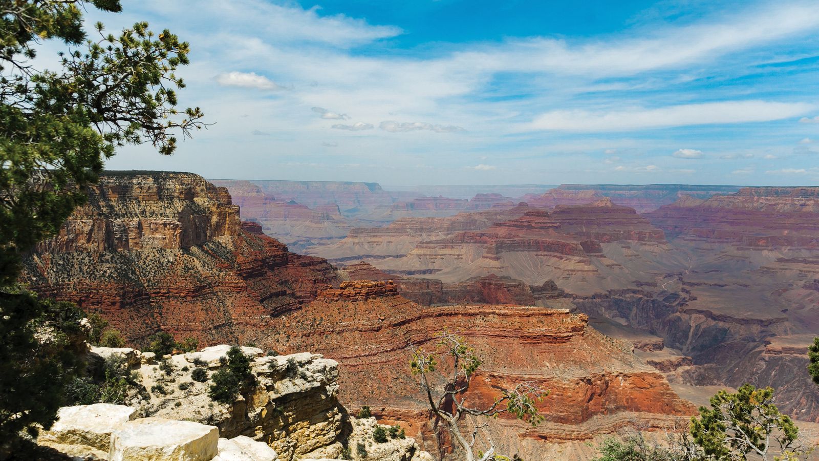 grand canyon south rim view with partially cloudly sky