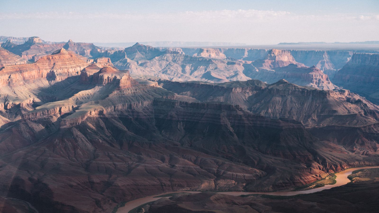 A shadowy section of the Grand Canyon National Park stretching into the distance.