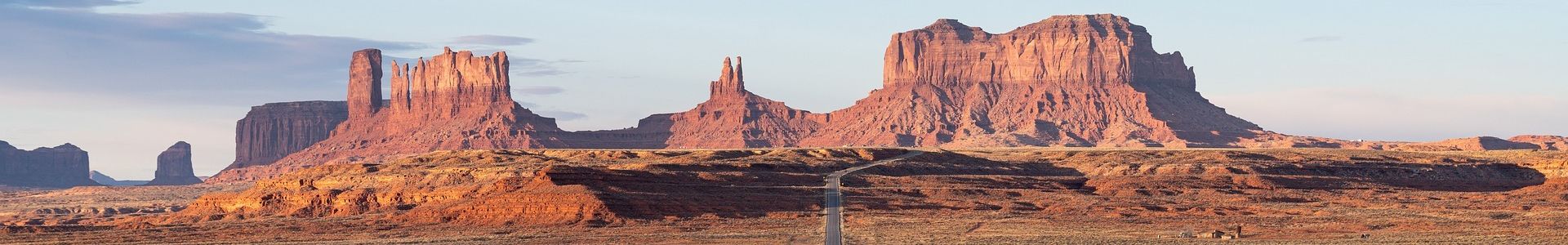 a Monument Valley landscape split in half by a highway road