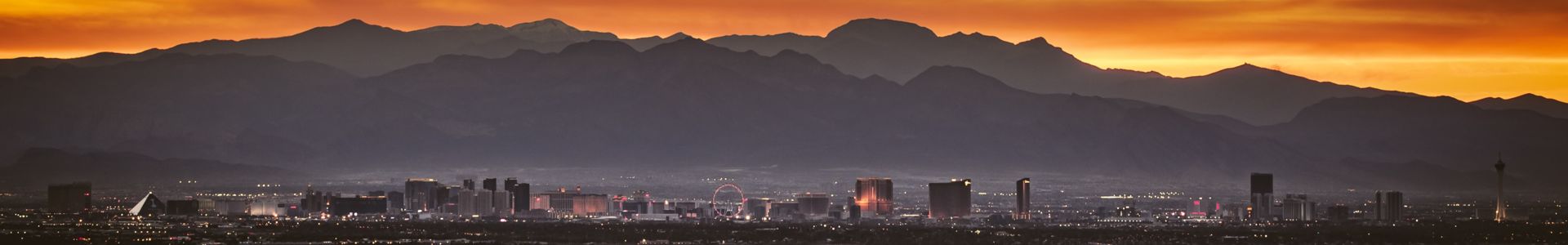 sunset behind mountains with the las vegas strip 