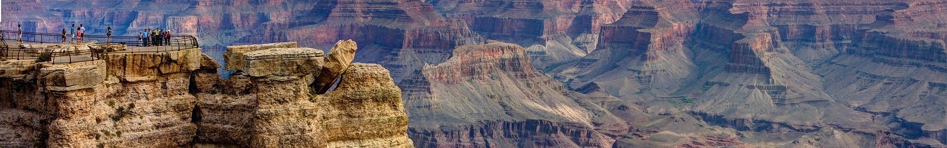 grand canyon visitors at a viewpoint
