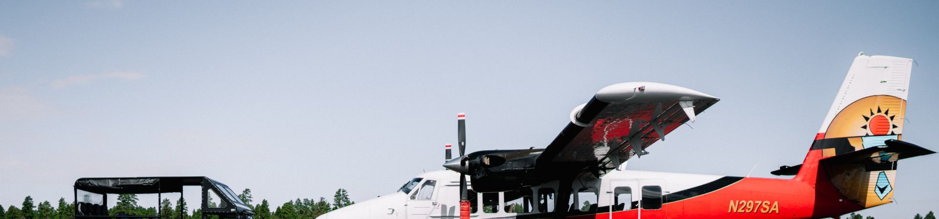 A sightseeing airplane and a military-style Hummer from Papillon Helicopters