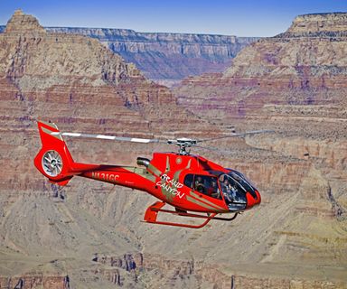 A helicopter tour seen mid-flight over the Grand Canyon