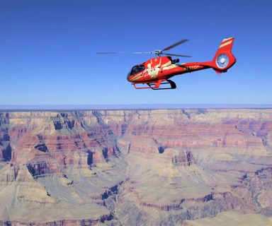 An EcoStar Helicopter flies over the Grand Canyon South Rim