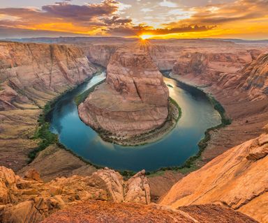 horseshoe bend in page arizona seen with a cloudy sky in the background