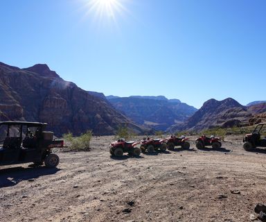 ATVs parked near the Grand Canyon preparing for an off-road adventure