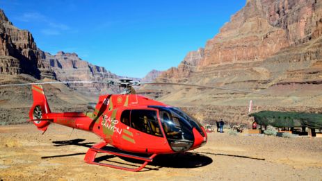 A helicopter landing at the bottom of the Grand Canyon West