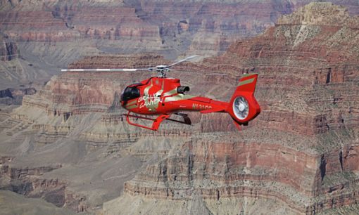 Helicopter Air Tour Red EC130 helicopter over the Grand Canyon