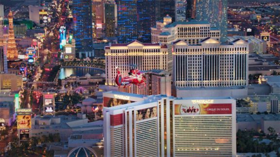 a helicopter flies over the Strip on a Las Vegas proposal package