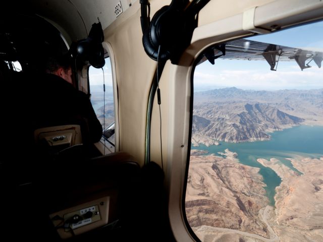 View through a Cessna Caravan cabin window over Lake Mead