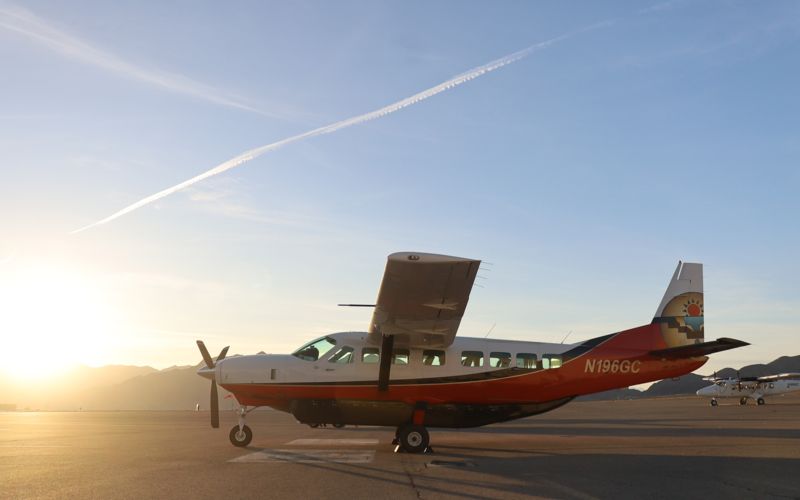 A Cessna Caravan on the tarmac at Boulder City at sunset