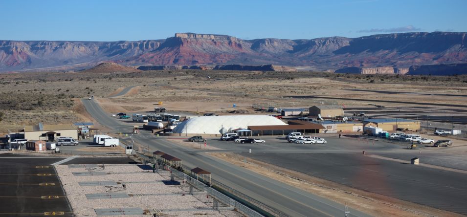view of the Grand Canyon West air terminal where several airplanes are parked near the airstrip