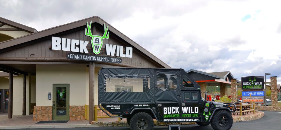 buck wild grand canyon hummer tours head quarters with a hummer parked in front of it