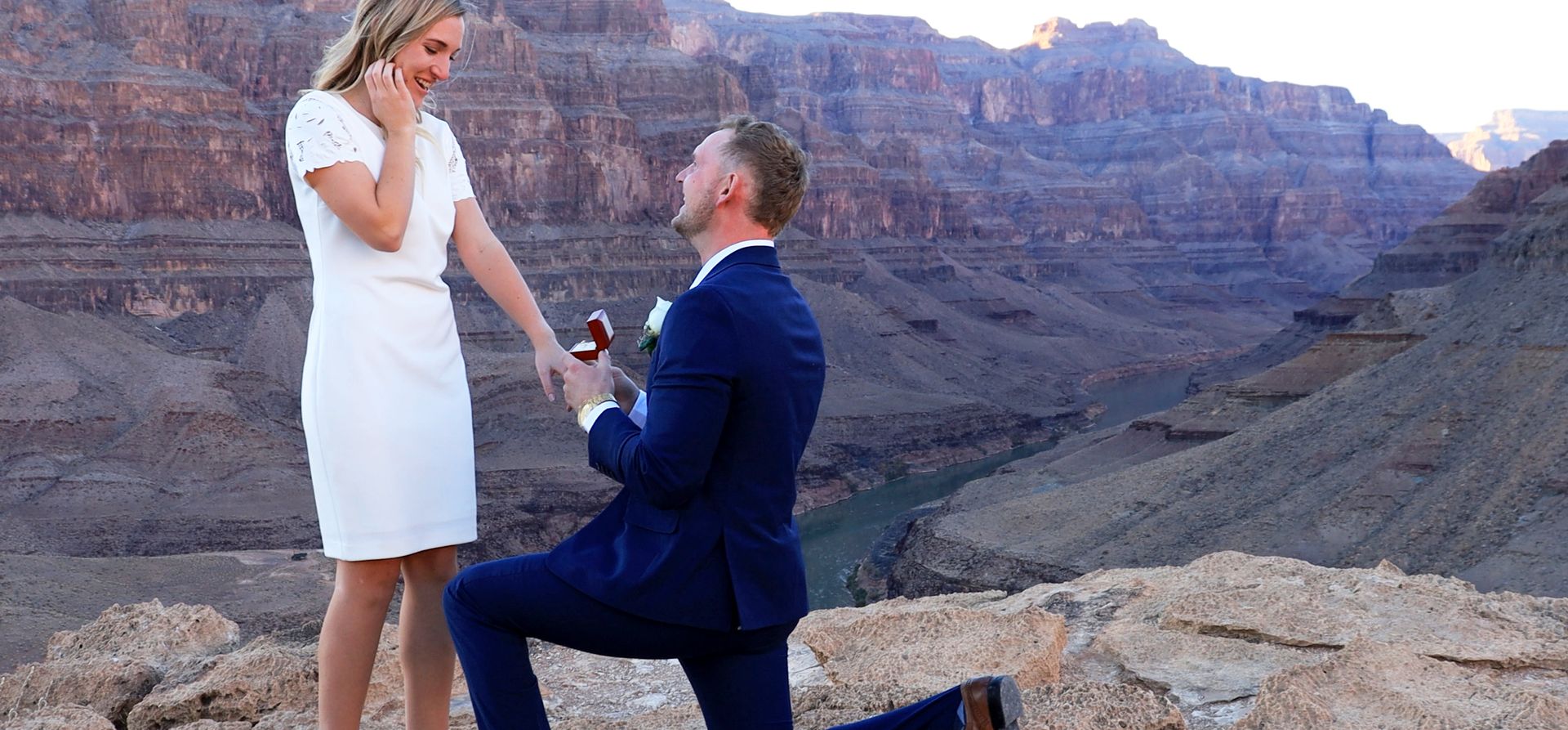 a marriage proposal taking place at the bottom of the Grand Canyon West