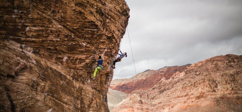 Visitors to Red Rock Canyon enjoying rock climbing on a sheer cliff face