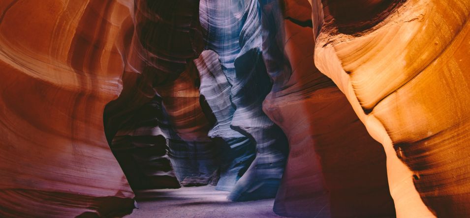 The striped walls of Lower Antelope Canyon splashed with sunlight
